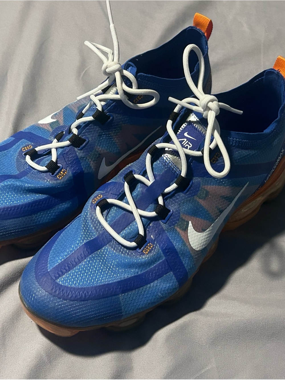 Blue and White Air VaporMax Sneakers with Orange Pull Tabs